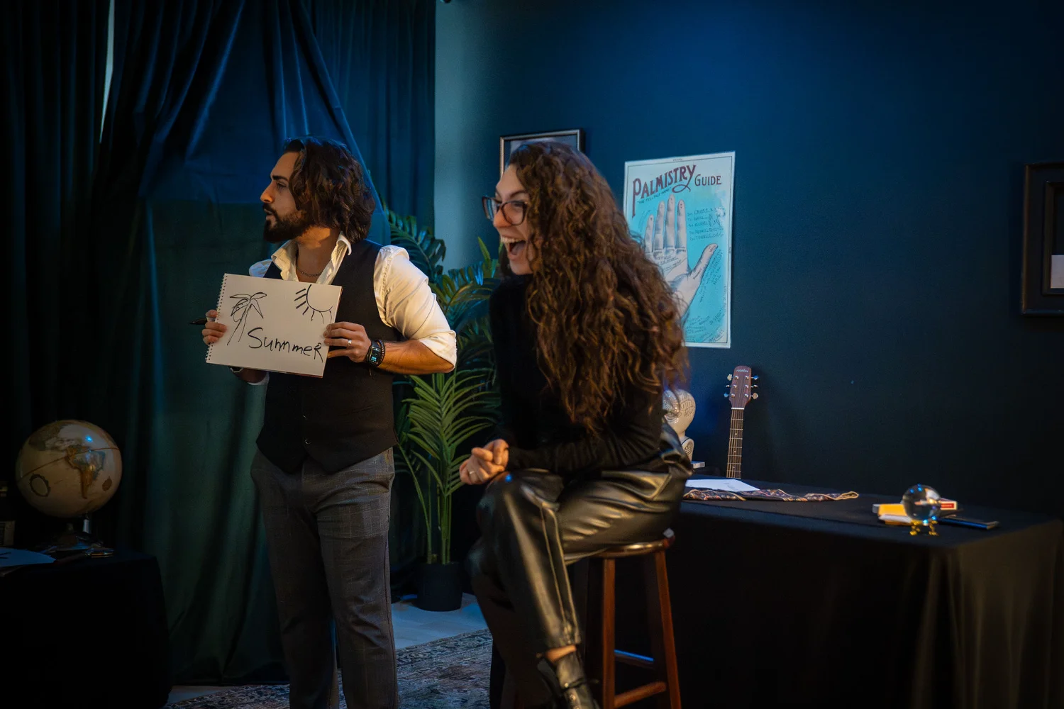 Edward Gebrael revealing a drawn prediction while a guest reacts in astonishment during a close-up mentalism performance